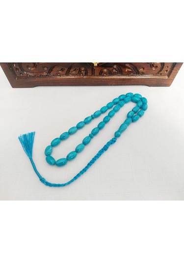 Turkuaz Renginde Örgülü Püskül Modelli Katalin...