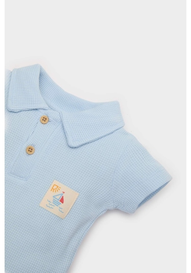 DeFacto Erkek Bebek Yenidoğan Polo Yaka Baskılı Waffle Kısa Kollu Çıtçıtlı Body E7935A525SMBE343 Mavi