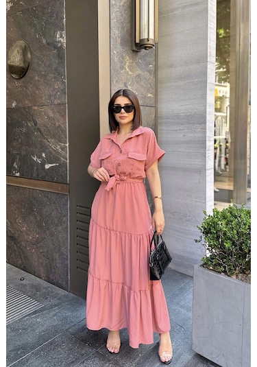 Gül Kurusu Kısa Kol, Airobin Kumaş, Yarım Patlı, Kuşaklı, Eteği Pliseli, Cepli Maxi Uzun Elbise Pembe