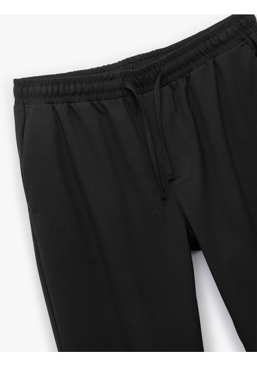 Koton Beli Bağcıklı Katlamalı Paça Cep Detaylı Slim Fit Pantolon Siyah 6wam40038hw Siyah