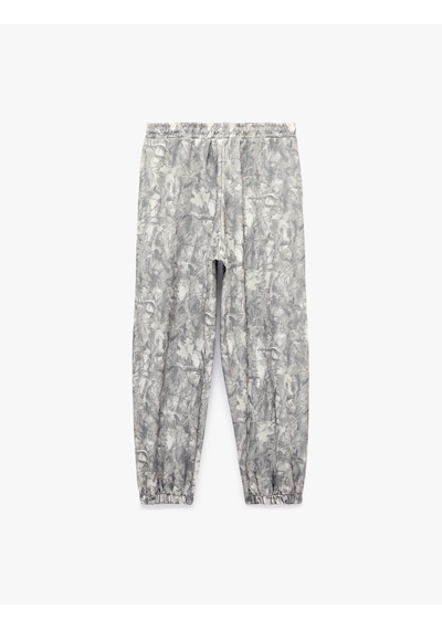 Koton Beli Bağcıklı Cepli Soyut Baskılı Rahat Kalıp Balon Fit Jogger Eşofman Altı Gri Desenli 7wal40092ık Koton Beli Bağcıklı Cepli Soyut Baskılı Rahat Kalıp Balon Fit Jogger Eşofman Altı Gri Desenli 7wal40092ık