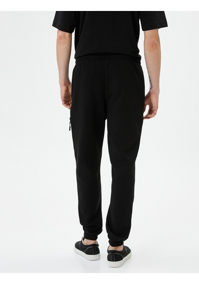 Koton Jogger Eşofman Altı Beli Bağcıklı Fermuar Detaylı Cepli Siyah 4sam40038mk 4SAM40038MK999 Siyah Koton Jogger Eşofman Altı Beli Bağcıklı Fermuar Detaylı Cepli Siyah 4sam40038mk 4SAM40038MK999 Siyah