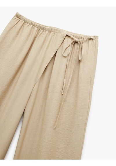 Koton Viskon Kumaş Rahat Kalıp Yırtmaç Detaylı Beli Bağcıklı Cepli Kruvaze Oversize Pantolon Bej 5sak40462pw Ekru Koton Viskon Kumaş Rahat Kalıp Yırtmaç Detaylı Beli Bağcıklı Cepli Kruvaze Oversize Pantolon Bej 5sak40462pw Ekru