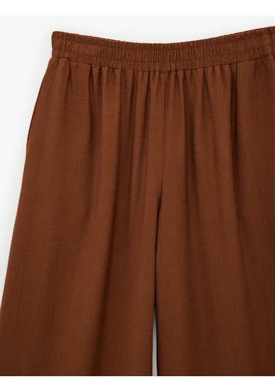 Koton Viskon Karışımlı Beli Lastikli Loose Fit Geniş Paça Palazzo Pantolon Bakır 6sak40217uw Bakır Koton Viskon Karışımlı Beli Lastikli Loose Fit Geniş Paça Palazzo Pantolon Bakır 6sak40217uw Bakır