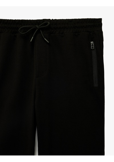 Koton Pamuklu Fermuarlı Cepli Lastikli Paça Beli Bağcıklı Jogger Spor Eşofman Altı Siyah 6sam40018nk Koton Pamuklu Fermuarlı Cepli Lastikli Paça Beli Bağcıklı Jogger Spor Eşofman Altı Siyah 6sam40018nk