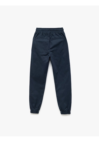 Koton Beli Bağcıklı Cep Detaylı Pamuklu Gabardin Jogger Pantolon Lacivert 7wkb40001tw