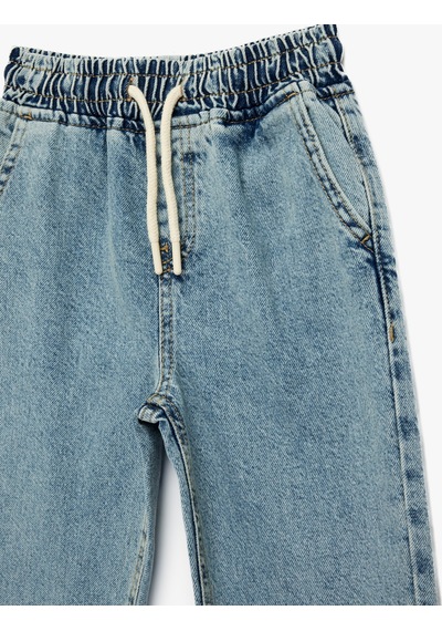 Koton Pamuklu Beli Bağcıklı Oversize Denim Jogger Pantolon Lıght Indıgo 6skb40025td Açık Mavi Koton Pamuklu Beli Bağcıklı Oversize Denim Jogger Pantolon Lıght Indıgo 6skb40025td Açık Mavi