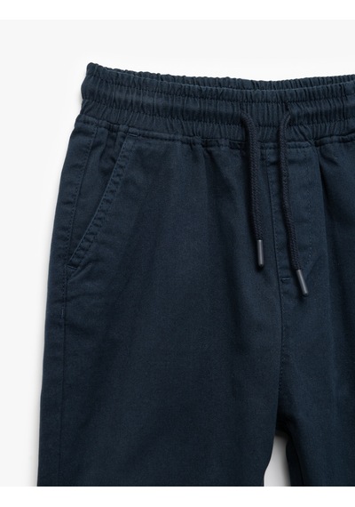 Koton Beli Bağcıklı Cep Detaylı Pamuklu Gabardin Jogger Pantolon Lacivert 7wkb40001tw