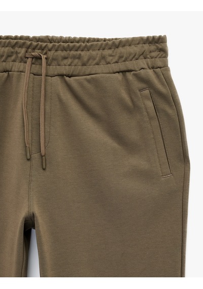 Koton Pamuklu Cepli Duble Paça Beli Bağcıklı Tapered Spor Eşofman Altı Bej 6sam40027nk Ekru Koton Pamuklu Cepli Duble Paça Beli Bağcıklı Tapered Spor Eşofman Altı Bej 6sam40027nk Ekru