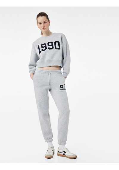 Koton Üç İplik Şardonlu Nakışlı Cepli Jogger Spor Eşofman Altı Gri Melanj 7wak40061nk Koton Üç İplik Şardonlu Nakışlı Cepli Jogger Spor Eşofman Altı Gri Melanj 7wak40061nk