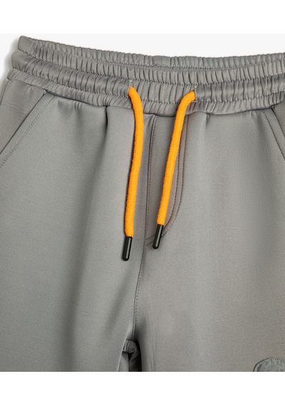 Koton Jogger Eşofman Altı Beli Bağlamalı Cepli Paraşüt Kumaş Detaylı Gri 4wkb40167tk 4WKB40167TK042 Gri