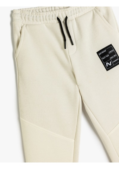 Koton Jogger Eşofman Altı Beli Bağlamalı Şardonlu Renk Bloklu Beyaz 5wkb40114tk Beyaz Koton Jogger Eşofman Altı Beli Bağlamalı Şardonlu Renk Bloklu Beyaz 5wkb40114tk Beyaz