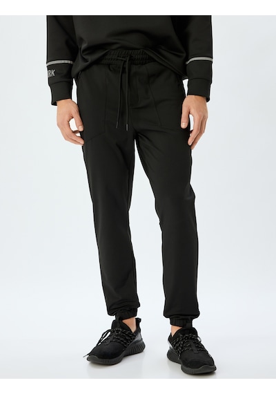 Koton Spor Eşofman Altı Jogger Beli Bağcıklı Fermuarlı Cep Detaylı Siyah 5wam40014nk Siyah Koton Spor Eşofman Altı Jogger Beli Bağcıklı Fermuarlı Cep Detaylı Siyah 5wam40014nk Siyah