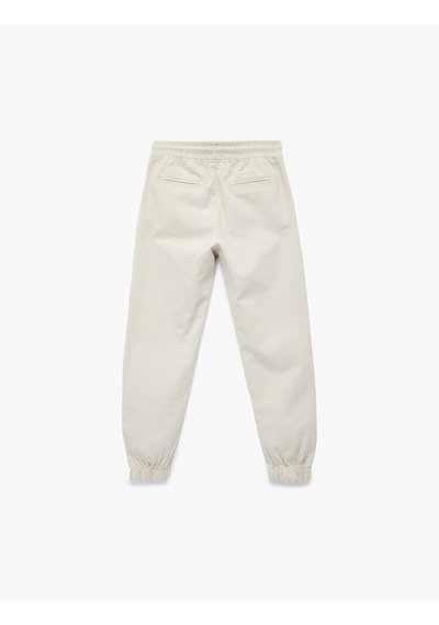 Koton Pamuklu Beli Bağcıklı Cepli Jogger Gabardin Pantolon Gri 6skb40018tw Gri Koton Pamuklu Beli Bağcıklı Cepli Jogger Gabardin Pantolon Gri 6skb40018tw Gri