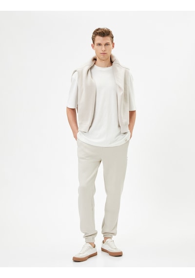 Koton Jogger Eşofman Altı Beli Bağcıklı Fermuar Detaylı Cepli Bej 4sam40038mk 4SAM40038MK050 Ekru Koton Jogger Eşofman Altı Beli Bağcıklı Fermuar Detaylı Cepli Bej 4sam40038mk 4SAM40038MK050 Ekru