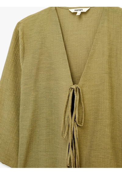 Koton Keten Karışımlı Uzun Geniş Kollu Önden Bağlamalı Fiyonk Detaylı Kısa Kimono Bluz Haki 6sak60133ew Haki Koton Keten Karışımlı Uzun Geniş Kollu Önden Bağlamalı Fiyonk Detaylı Kısa Kimono Bluz Haki 6sak60133ew Haki