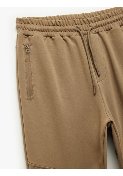 Koton Pamuklu Fermuarlı Cepli Beli Bağcıklı Jogger Eşofman Altı Kahverengi 6wam40019mk Kahve Koton Pamuklu Fermuarlı Cepli Beli Bağcıklı Jogger Eşofman Altı Kahverengi 6wam40019mk Kahve