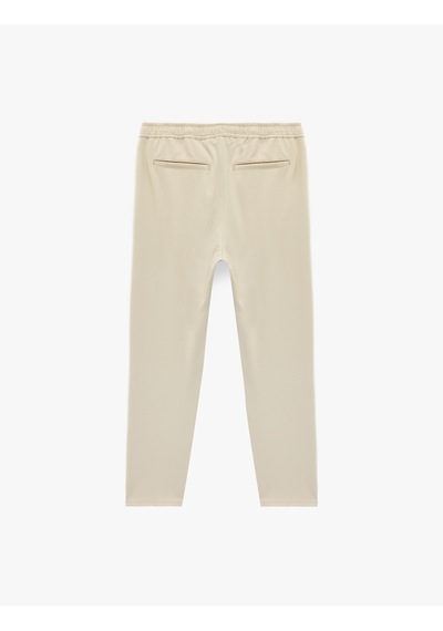 Koton Regular Fit Cepli Beli Bağcıklı Kumaş Pantolon Bej 6sam40014hw Ekru Koton Regular Fit Cepli Beli Bağcıklı Kumaş Pantolon Bej 6sam40014hw Ekru