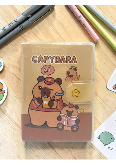 Capybara A7 Not Defteri , Çıt Çıtlı Cep Defteri - Kitap Okuyan Capybara Sarı