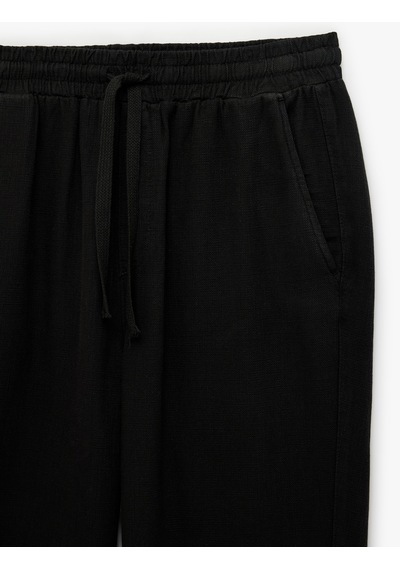 Koton Regular Fit Pamuklu Cepli Beli Bağcıklı Lastikli Pantolon Siyah 7wam40050hw