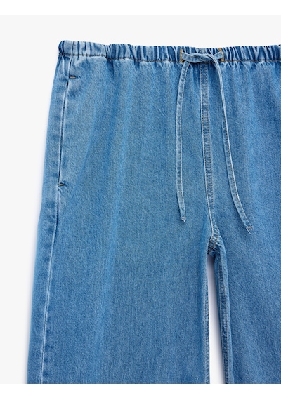 Koton Beli Bağcıklı Cep Detaylı Bol Paça Denim Pantolon Açık İndigo 6sal40041md