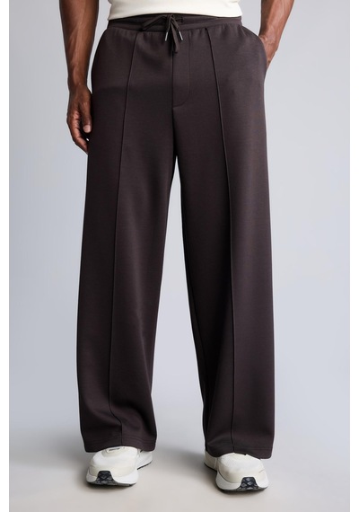 Defacto Ultra Yumuşak Baggy Fit Elastik Bel Ön Dikiş Detaylı Dalgıç Kumaş Jogger Pantolon H6171ax26aubn338 Kahve-bn338