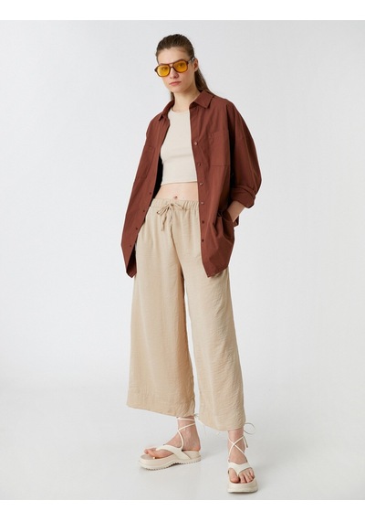 Koton Crop Pantolon Bol Paça Beli Bağlamalı Saten Görünümlü Taş 2sak40119pw Taş