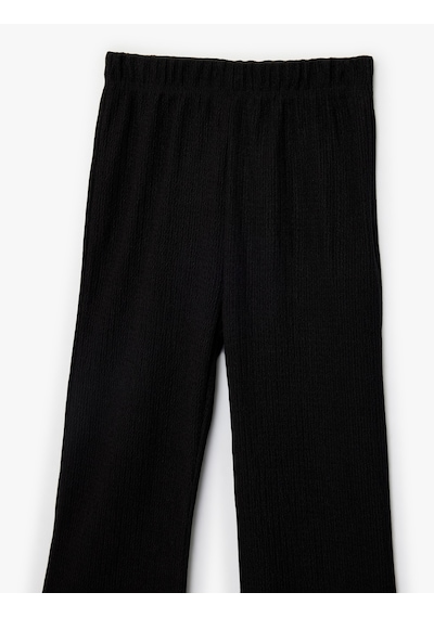 Koton Bürümcük Kumaş Beli Lastikli İspanyol Paça Pantolon Siyah 6skg40015ak Siyah Koton Bürümcük Kumaş Beli Lastikli İspanyol Paça Pantolon Siyah 6skg40015ak Siyah
