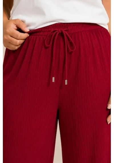 DefyModa Battal Beden Bürümcük Kumaş Beli Lastikli Bağcıklı Bol Paça Palazzo Pantolon - Bordo DefyModa Battal Beden Bürümcük Kumaş Beli Lastikli Bağcıklı Bol Paça Palazzo Pantolon - Bordo