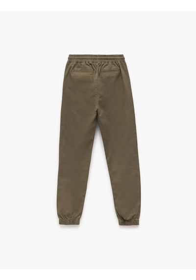 Koton Beli Bağcıklı Cep Detaylı Pamuklu Gabardin Jogger Pantolon Haki 7wkb40001tw