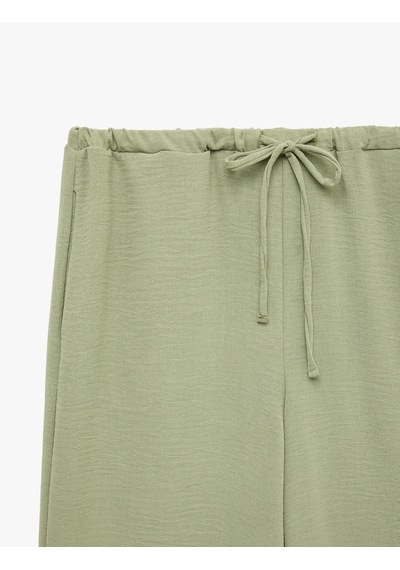 Koton Keten Görünümlü Beli Bağcıklı Cepli Düz Geniş Paça Pantolon Haki 6sak40385pw
