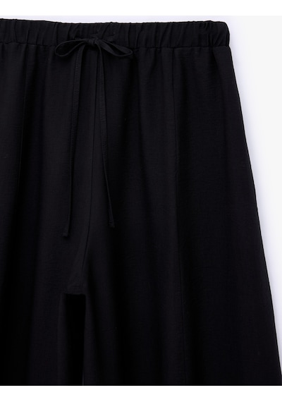 Koton Viskon Kumaş Beli Bağcıklı Loose Fit Cepli Balon Pantolon Siyah 7wak40043pw