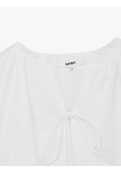 Koton Pamuklu Poplin Kumaş Önden Bağlamalı Kısa Kollu Balon Fit Oversize Crop Bluz Beyaz 6sak60440uw Koton Pamuklu Poplin Kumaş Önden Bağlamalı Kısa Kollu Balon Fit Oversize Crop Bluz Beyaz 6sak60440uw