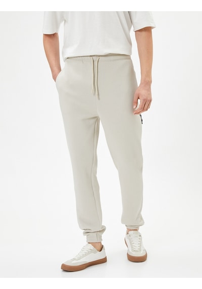 Koton Jogger Eşofman Altı Beli Bağcıklı Fermuar Detaylı Cepli Bej 4sam40038mk 4SAM40038MK050 Ekru Koton Jogger Eşofman Altı Beli Bağcıklı Fermuar Detaylı Cepli Bej 4sam40038mk 4SAM40038MK050 Ekru