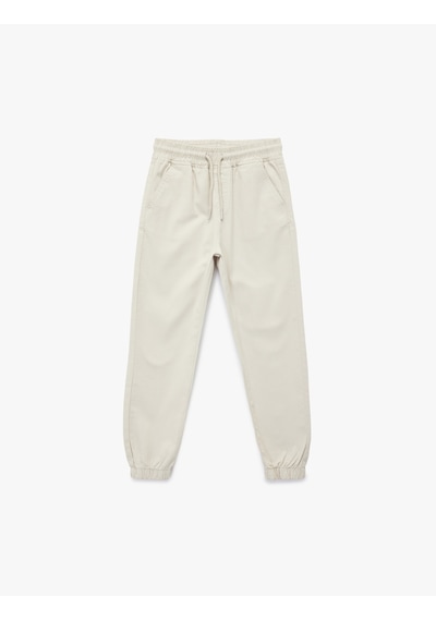 Koton Pamuklu Beli Bağcıklı Cepli Jogger Gabardin Pantolon Gri 6skb40018tw Gri Koton Pamuklu Beli Bağcıklı Cepli Jogger Gabardin Pantolon Gri 6skb40018tw Gri