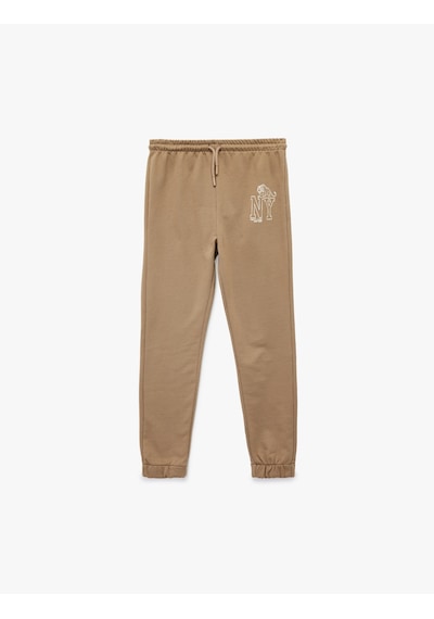 Koton Jogger Eşofman Altı Beli Bağlamalı Baskı Detaylı Kahverengi 7wkb40016tk Kahve