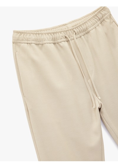 Koton Straight Fit Pike Kumaş Cep Detaylı Rahat Kesim Beli Bağcıklı Pantolon Bej 6wam40006hk Ekru Koton Straight Fit Pike Kumaş Cep Detaylı Rahat Kesim Beli Bağcıklı Pantolon Bej 6wam40006hk Ekru