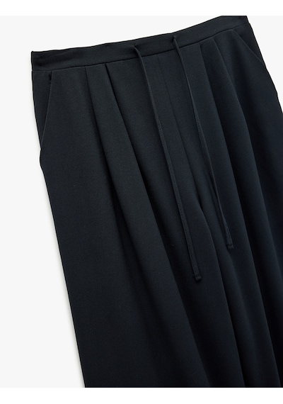 Koton Beli Bağlamalı Cepli Geniş Paça Kumaş Baggy Pantolon Lacivert 6wak40150pw Lacivert Koton Beli Bağlamalı Cepli Geniş Paça Kumaş Baggy Pantolon Lacivert 6wak40150pw Lacivert