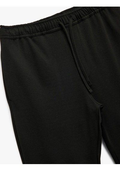 Koton Straight Fit Pike Kumaş Cep Detaylı Rahat Kesim Beli Bağcıklı Pantolon Siyah 7wam40003hk