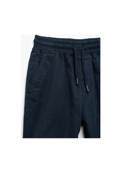 Koton Erkek Çocuk Beli Bağcıklı Cep Detaylı Pamuklu Gabardin Jogger Pantolon Lacivert
