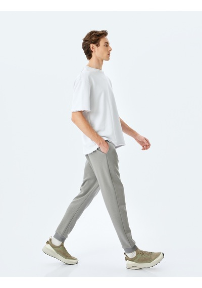 Koton Regular Fit Cepli Şardonlu Pamuk Karışımlı Beli Bağcıklı Kışlık Eşofman Altı Gri 5wam40066mk Koton Regular Fit Cepli Şardonlu Pamuk Karışımlı Beli Bağcıklı Kışlık Eşofman Altı Gri 5wam40066mk
