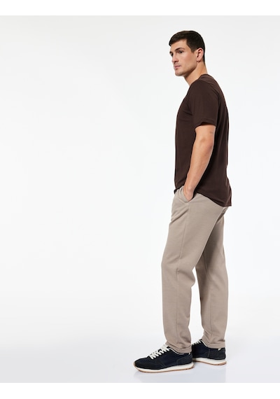 Koton Straight Fit Pike Kumaş Cep Detaylı Rahat Kesim Beli Bağcıklı Pantolon Vizon 6wam40006hk Vizon Koton Straight Fit Pike Kumaş Cep Detaylı Rahat Kesim Beli Bağcıklı Pantolon Vizon 6wam40006hk Vizon