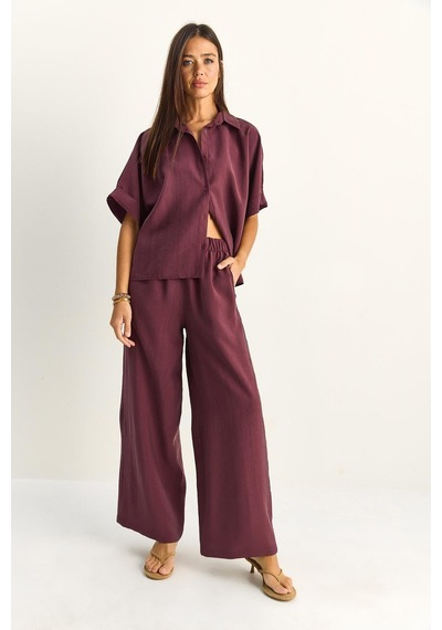 Shade Kadın Oversize Kısa Kol Gömlek Beli Lastikli Geniş Paça Pantolon Takım 7651 60286138 - Mürdüm Shade Kadın Oversize Kısa Kol Gömlek Beli Lastikli Geniş Paça Pantolon Takım 7651 60286138 - Mürdüm