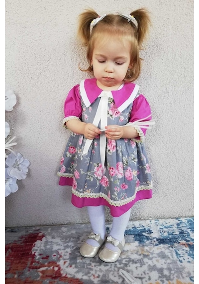 Kurdele Ve Dantel Detaylı Çiçek Desenli Menekşe Renk Kız Çocuk Bebek Elbise 001 Kurdele Ve Dantel Detaylı Çiçek Desenli Menekşe Renk Kız Çocuk Bebek Elbise 001