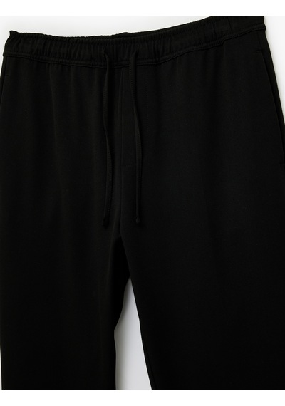 Koton Regular Fit Cepli Beli Bağcıklı Kumaş Pantolon Siyah 6sam40014hw Siyah Koton Regular Fit Cepli Beli Bağcıklı Kumaş Pantolon Siyah 6sam40014hw Siyah