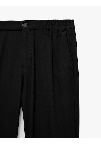 Koton Viskon Karışımlı Cepli Beli Lastikli Düğmeli Slim Fit Pileli Kumaş Pantolon Siyah 7wam40082nw Koton Viskon Karışımlı Cepli Beli Lastikli Düğmeli Slim Fit Pileli Kumaş Pantolon Siyah 7wam40082nw