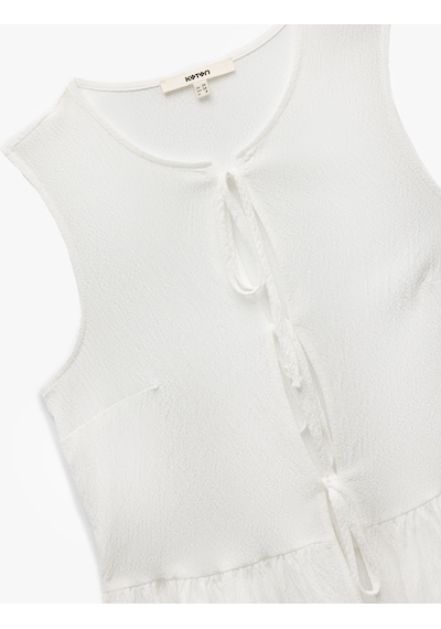 Koton Bisiklet Yaka Fiyonklu Önden Bağlamalı Kolsuz Peplum Bluz Ekru 5sak60176ew Ekru