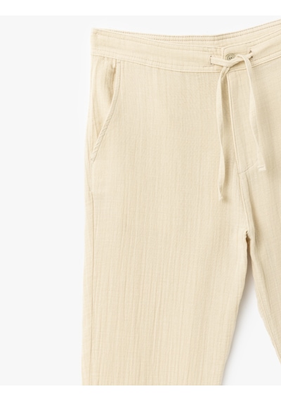 Koton Pamuklu Müslin Chino Cep Detaylı Beli Bağcıklı Pantolon Bej 5sam40011hw Ekru Koton Pamuklu Müslin Chino Cep Detaylı Beli Bağcıklı Pantolon Bej 5sam40011hw Ekru