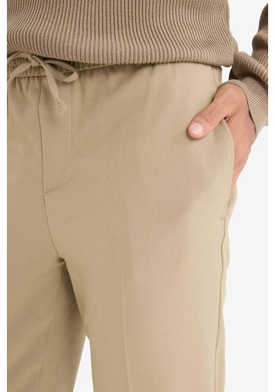 DeFacto Yazlık Kumaş Jogger Pantolon Beli Bağcıklı Lastikli Düz Paça Cepli Her Yöne Esneyen A9943AX25SPBG315