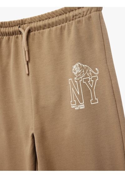 Koton Jogger Eşofman Altı Beli Bağlamalı Baskı Detaylı Kahverengi 7wkb40016tk Kahve
